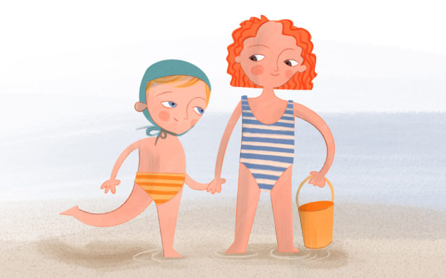 Zweikinder stehen am Strand, Hand in Hand mit einem Sandeimer