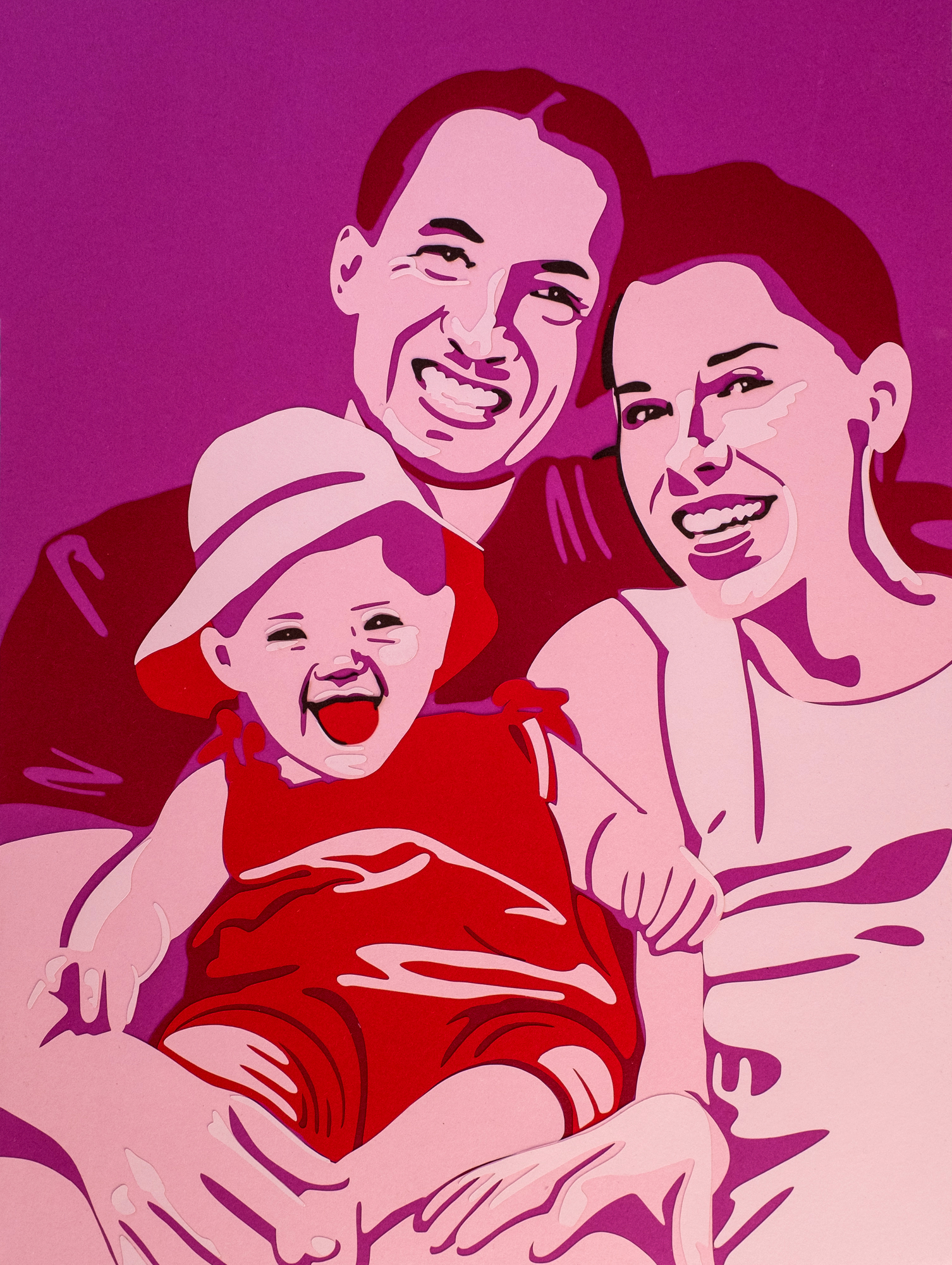 Ein Papercut Porträt von einer Familie.