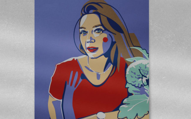 Ein Papercut Porträt einer Frau in einem Bilderrahmen.
